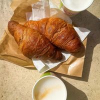 Croissants and oat milk coffee   at Talè  in Palermo
