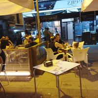 Outdoor sitting area at Bar Queen's in Madrid
