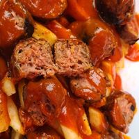 Vegan currywurst over fries at Schulz Bräu Brewing Company in Knoxville