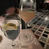Seasonal peach Bellini and lemon water  at Contessa in Boston