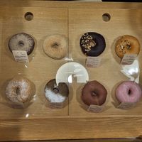 Row behind from the left: Mocha, Kinako, Chocolate, peanuts / Front row from the left: plain, sweet potato & green tea, cinnamon, strawberry at Doughnut Cafe Nicotto & Mam in Kyoto