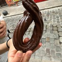 Dark chocolate covered churro at La Xurreria de la Cort Reial in Girona