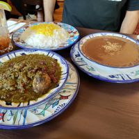 On the right: fesenjan stew of walnuts and pomegranate at Apadana in Vienna