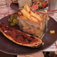 Stuffed eggplant, with salad and fries. at le Café de la Comédie in Carcassonne