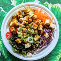Go Go Tofu Bowl
Roasted tofu, teriyaki glaze, rice, avocado, tomato, cabbage, carrots, seaweed salad, scallion and sesame seeds. at Smoothie Shuttle in Key West