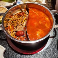 Mushroom broth left, tomato broth on the right at Lius Hotpot - 刘一手重庆火锅 Liu Yi Shou in Frankfurt