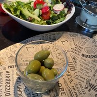 Olives and side salad  at L'Osteria - Elisabethstraße in Munich
