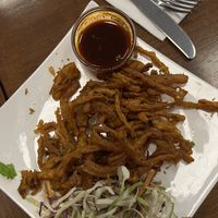 Onion Bajhi and tasty tamarind sauce  at The Indian Cafe - Stoke in Nelson
