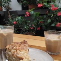 Iced Latte Macchiato with Oat milk and a vegan apple streusel pudding cake at Nachbarschaft  in Heidelberg