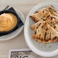 Hummus and pita. The pita bread was amazing and drizzled with olive oil.   at Vegera   in Mykonos
