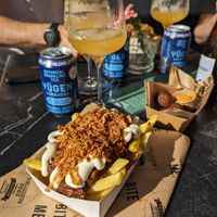 vegan 'Julientje': Belgian fries, satay seasoning, Flemish stew, mayonaise, sliced 'viandel' crispy sausage & crispy onions at OhMA Gent in Ghent