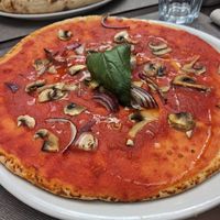 Marinara with very expensive toppings (extra champignons 2€, extra onion 1€] at Piazza Grande in Locarno