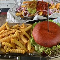 Burger and loaded fries with guacamole salsa kidney beans corn and onions  at HighFive in Winterberg