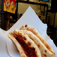 Pizza with olives and mushrooms at 'A Puteca d' 'a Pizza in Naples