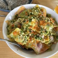 Beet filled ravioli with a miso, tomato butter sauce and gremolata    at Vegan Academy in Amsterdam