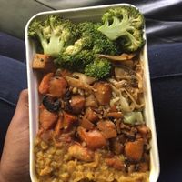 Dahl, broccoli, tofu stir fry, brown rice, carrots and who knows what else is packed in underneath. Delicious   at Planet Organic - Torrington Place in London
