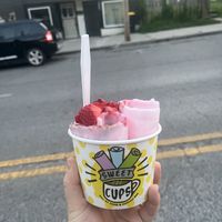 Cherry chocolate rolled ice cream topped with raspberries and strawberries  at Sweet Cups Roll Ice Cream & Coffee in Kansas City