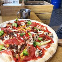 Veganized veggie pizza, simple but not bad, healthy. Dough is vegan. Topping: broccoli, tomatoes, sweet pepper, mushrooms, caramelized onions. Ask to omit cheese. at dors in Yerevan