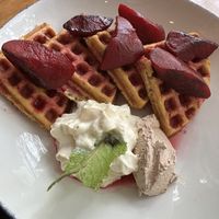 Beet waffles with house MAPLE BUTTER (the brown dollop) 🤤  at The Butcher's Daughter - Nolita in New York City