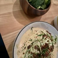 Bacon carbonara made vegan and a side of greens  at The Butcher's Daughter - Nolita in New York City