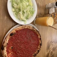 La rossa pizza and green salad   at Coogi's Pizzeria & Bistrot in Mdina