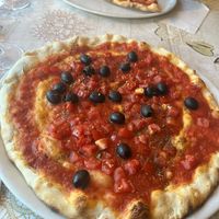 Olives, garlic and a thick tomato sauce  at Il Beccafico in San Marino City