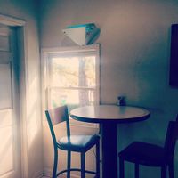 a high-top beside a window inside Sunflower Cafe at Sunflower Cafe in Nashville