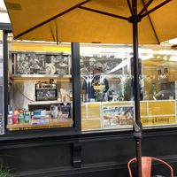 No indoor space; just a booth with tables in front at Wafels & Dinges in New York City