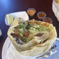 Vegetarian burrito minus cheese with chips. Delicious and fresh!  at Taqueria El Sabor in Tacoma