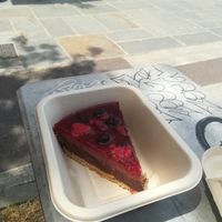 Chocolate and raspberry vegan cheesecake with red fruits at Cuore Verde in Milan
