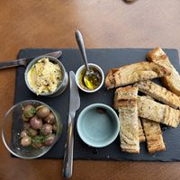 Olives, hummus, and breadd  at Mela Canela - Sintra Centre in Sintra