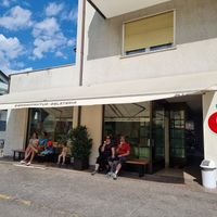 Outside, some benches to sit at AiJOO Eismanufaktur  in Naturno