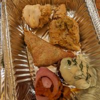 Spinach pie, hasselback potatoes, some other veggie parcels/fritters at Annie's Vegan Food and Bar - Pop-up in Rhodes