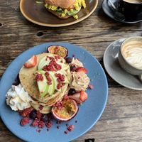This morning’s blueberry pancakes. And Brekky Burger.   at Sweet Bones Bakery Cafe in Scullin