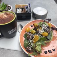 Pumpkin spice oat latte and evergreen bagel 💚  at Urban Coffee Lab in Bolzano