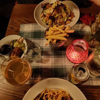 Top to bottom: Caesar salad, fries, fried mushroom bites and pasta norma at Rosetta's in Stockholm