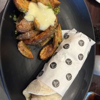 Wedges drizzled in vegan pesto & vegan mayonnaise   at Millsy's Cafe Bar in Coventry