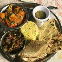 Mixed vegetables, okra, cilantro chutney, basmati rice with pomegranate seeds and spices, 2 different flatbreads at Marwari Indian Food in Tepoztlan