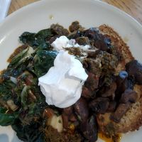 Greens and mushrooms on GF toast with coconut yogurt. at Postal Service in Auckland