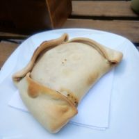 Empanada de seitán con queso y cebolla caramelizada at Happy Vegan Coffee in Santiago