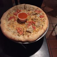 Vegan chicken ranch pizza with a side of buffalo sauce  at The Pie Underground in Salt Lake City