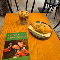 Pistachio croissant and iced coffee at Grey Kaffee in Vienna