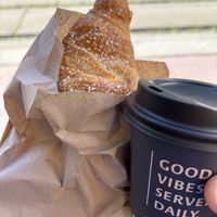 Chocolate croissant and cappuccino with oat milk   at Grey Kaffee in Vienna