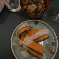 Main dish with a side of potatoes with mushrooms (included in the vegan menu)  at HEBE  in Paris