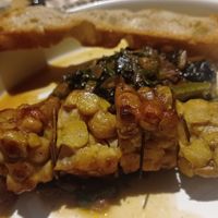 Tempeh di ceci con inzimino e focaccia toscana  at il Brucaliffo Cucina in Castiglione Dorcia