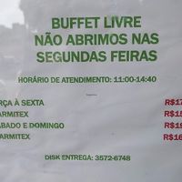 Hours of operation (open from 11:00 a.m. - 2:40 p.m.; closed Mondays; I believe "Marmitex" means lunch box, or takeout price) at Cheiro Verde in Foz Do Iguacu