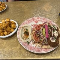Falafel open wrap platter with batata harra   at Comptoir Libanais in Ellesmere Port