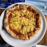 “Margarita” pizza with cheese I brought from home  at La Napoletana Pizzeria in Pristina