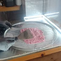 Mixing the ingredients at Chop and Roll in Kos