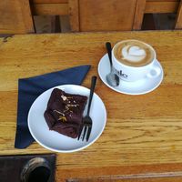 cappuccino & glutenfree brownie - both excellent - on vintage wooden furniture at A Little Lost in Munich